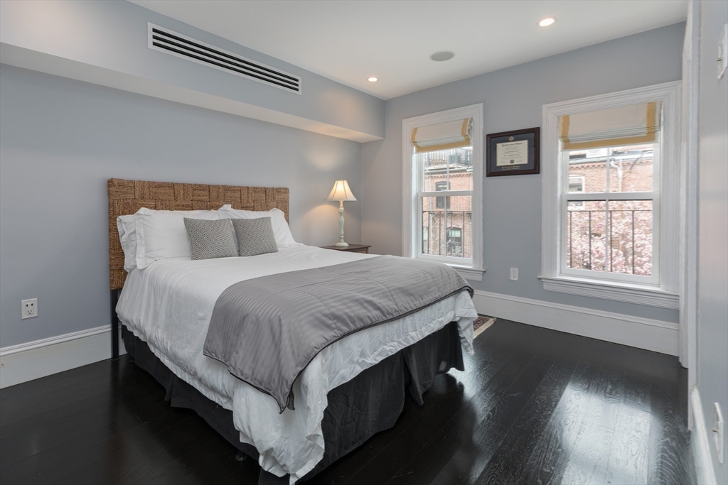 95 Appleton Street, Unit 2 Boston, MA 02116 - Photo 17 of 32 a bed room with a bed and a night stand