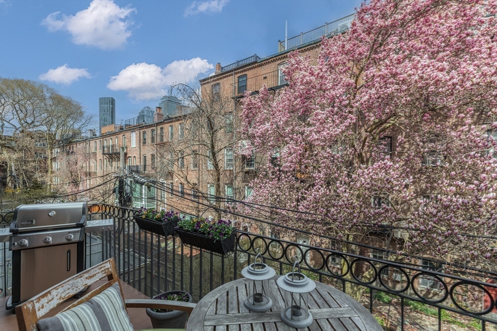 95 Appleton Street, Unit 2 Boston, MA 02116 - Photo 27 of 32 a view of a balcony with wooden fence