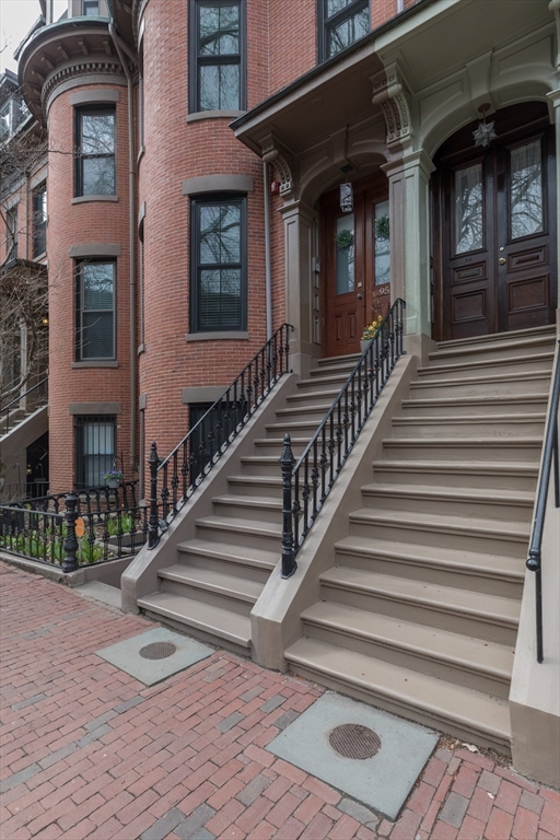 95 Appleton Street, Unit 2 Boston, MA 02116 - Photo 29 of 32 a view of a brick house with many windows