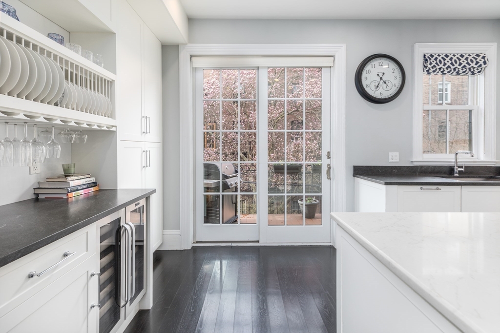 95 Appleton Street, Unit 2 Boston, MA 02116 - Photo 4 of 32 a view of a kitchen with a sink cabinets and a window