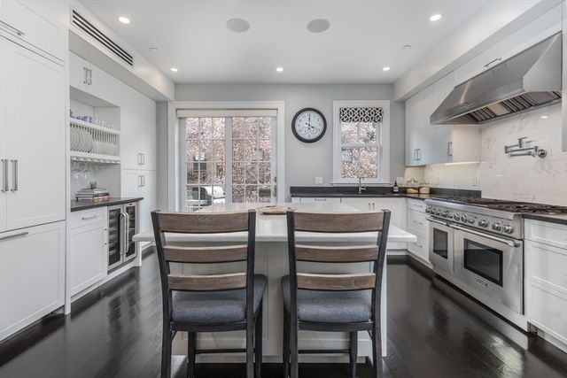 a kitchen with a stove a sink and a refrigerator