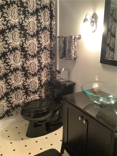 2240 Beulah Road Pittsburgh, PA 15235 - Photo 13 of 24 The updated bathroom has an onyx theme with a modern basin.
