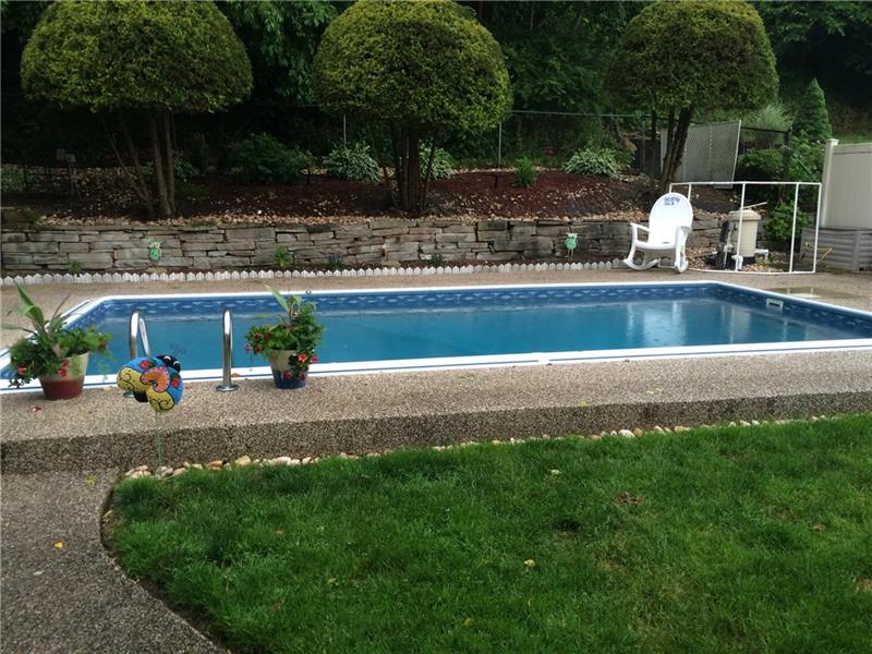 2240 Beulah Road Pittsburgh, PA 15235 - Photo 21 of 24 The is a previous image of the pool uncovered. The 24' X 12' in-ground pool is framed in beautiful custom Nature Stone around the full perimeter.
