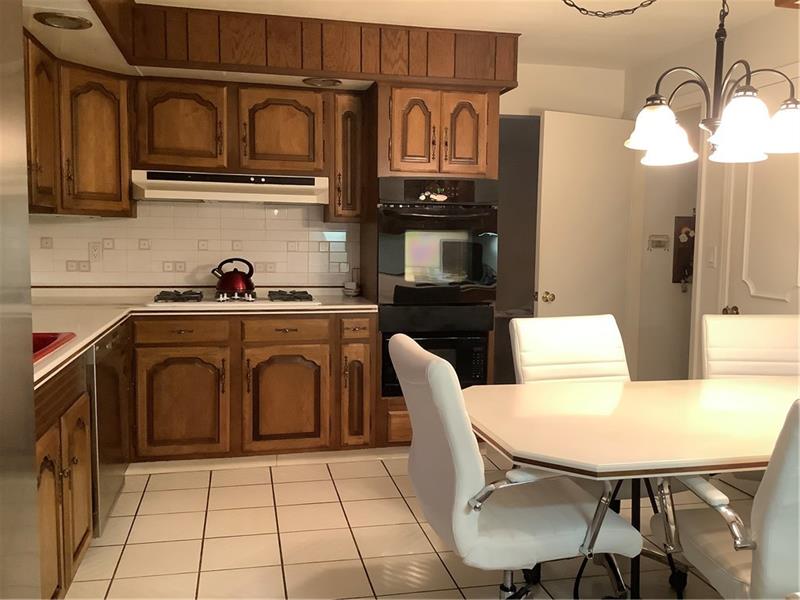 2240 Beulah Road Pittsburgh, PA 15235 - Photo 7 of 24 SS refrigerator, gas cook top, wall oven, microwave, trash compactor, and built-in toaster -all included!