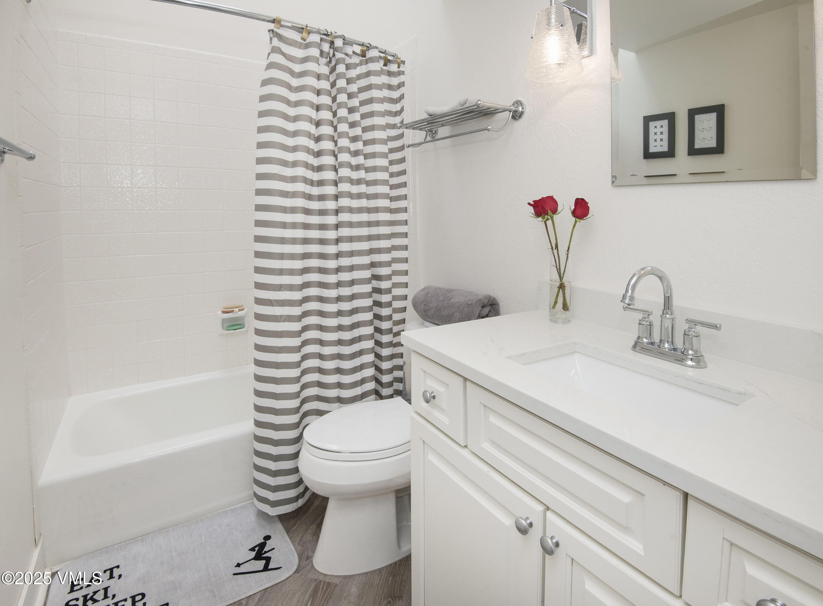 4480 Timber Falls Court, Unit 1507 Vail, CO 81657 - Photo 17 of 29 a bathroom with a sink toilet and shower