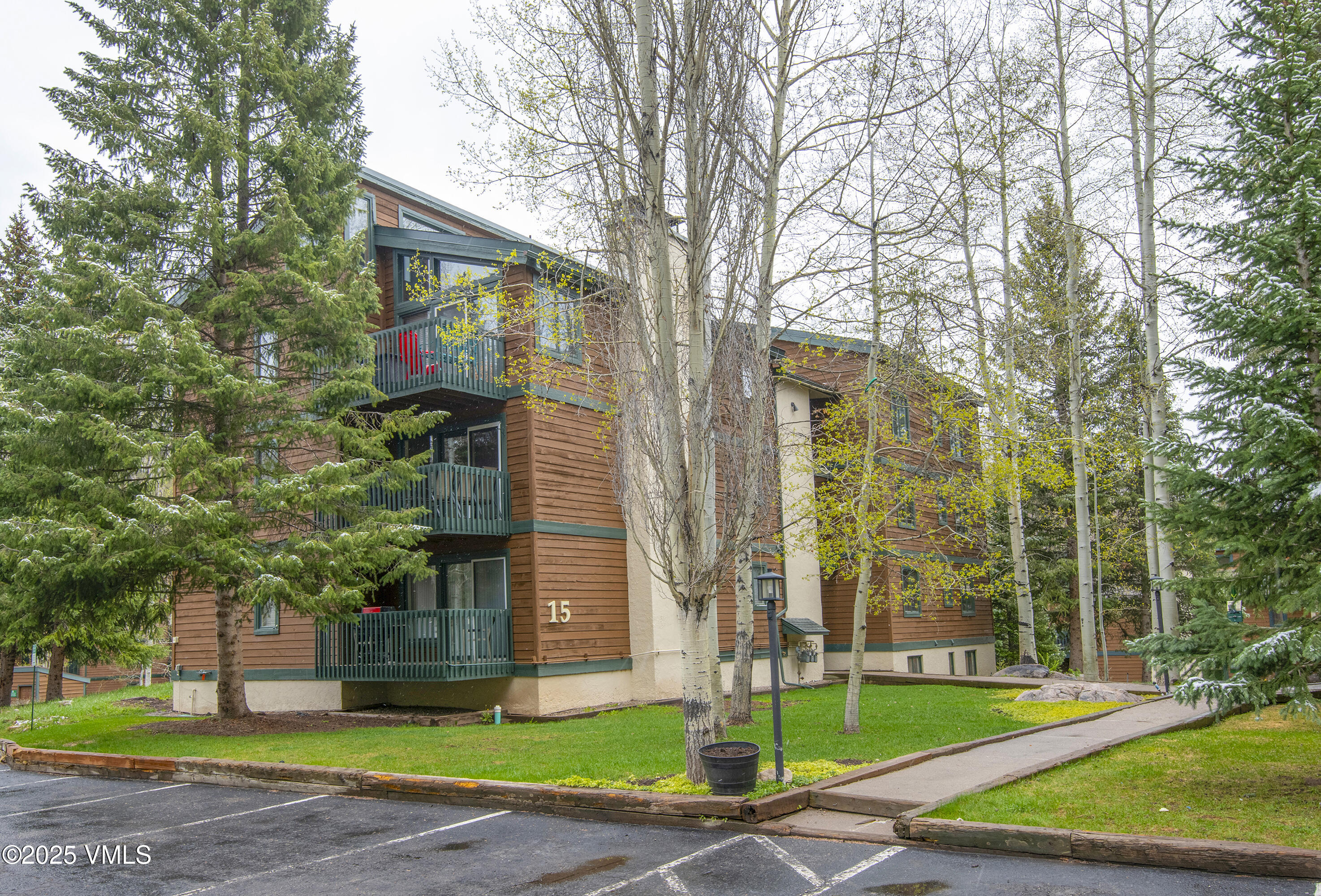 4480 Timber Falls Court, Unit 1507 Vail, CO 81657 - Photo 2 of 29 a front view of a building with garden