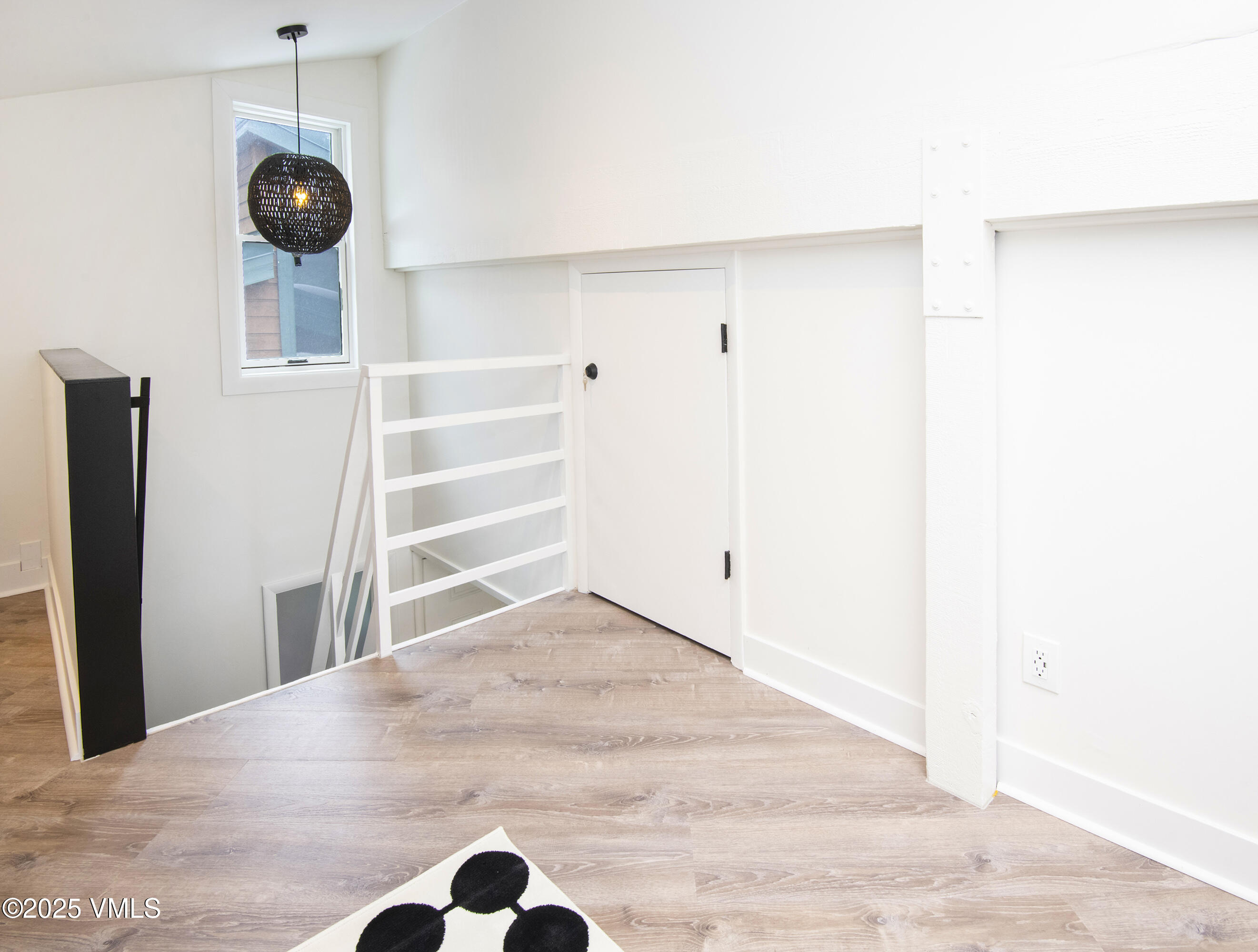 4480 Timber Falls Court, Unit 1507 Vail, CO 81657 - Photo 22 of 29 a view of a room with wooden floor