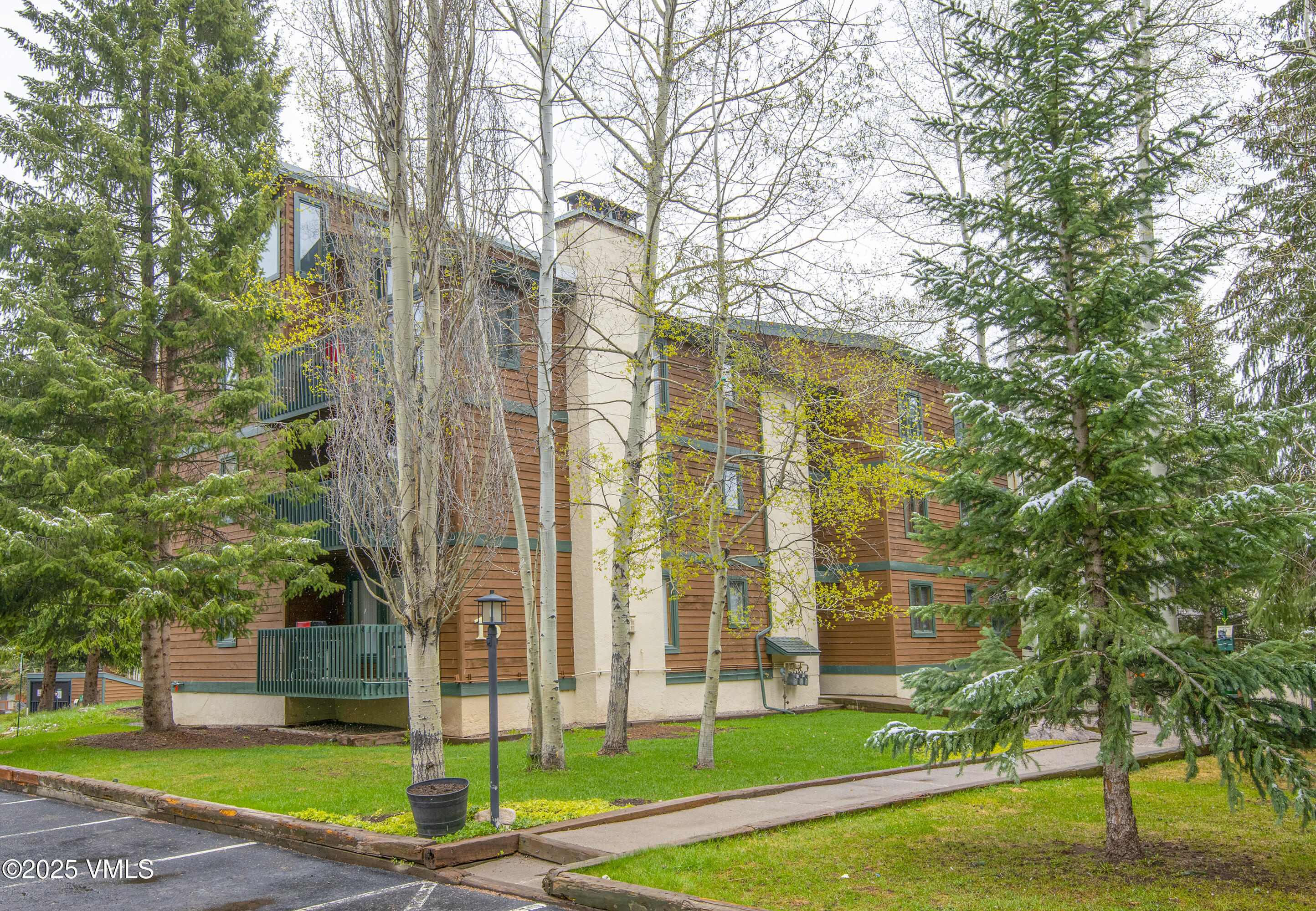 4480 Timber Falls Court, Unit 1507 Vail, CO 81657 - Photo 24 of 29 a view of a city with tall buildings and a big yard