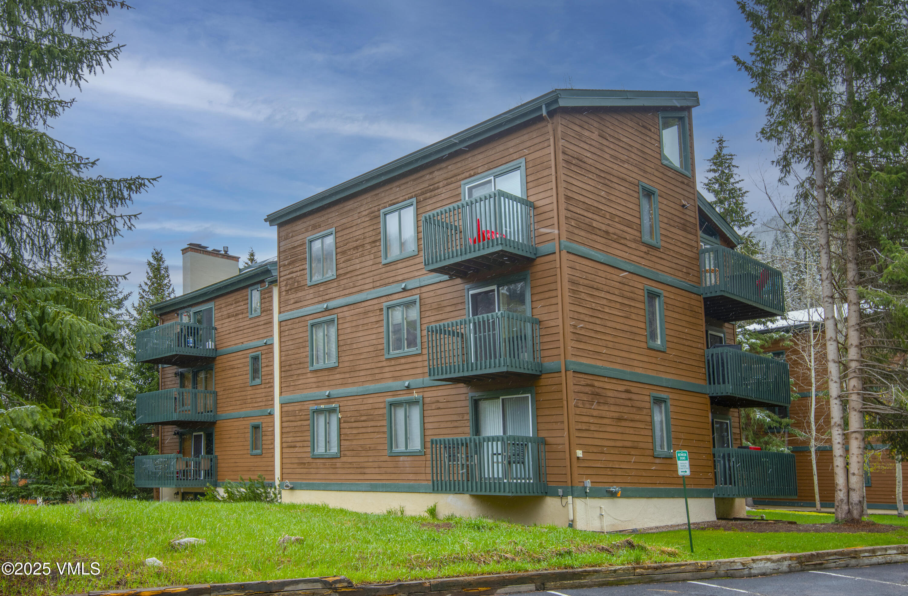 4480 Timber Falls Court, Unit 1507 Vail, CO 81657 - Photo 25 of 29 a view of a house with a yard
