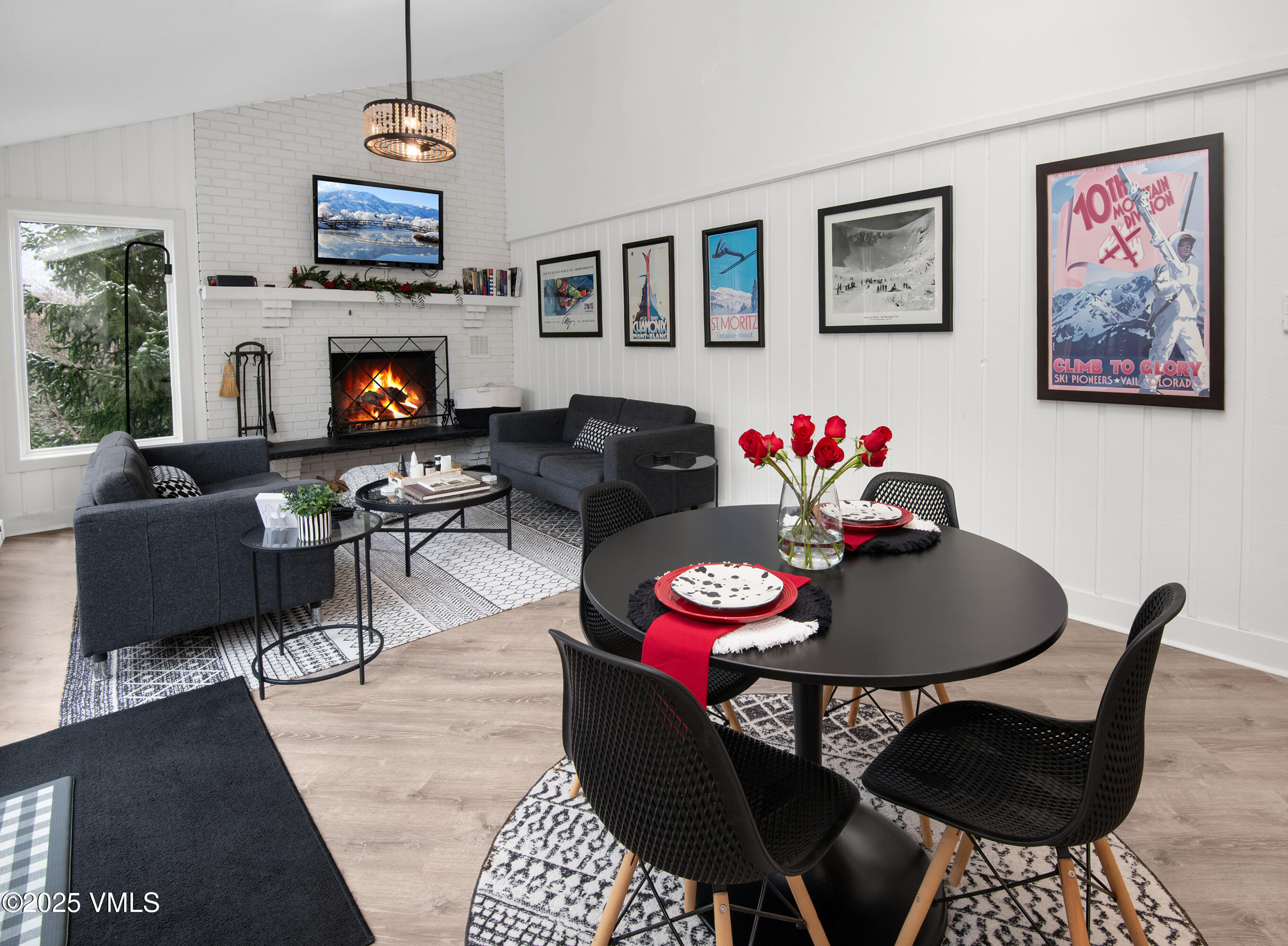 4480 Timber Falls Court, Unit 1507 Vail, CO 81657 - Photo 3 of 29 a living room with furniture a flat screen tv and a dining table