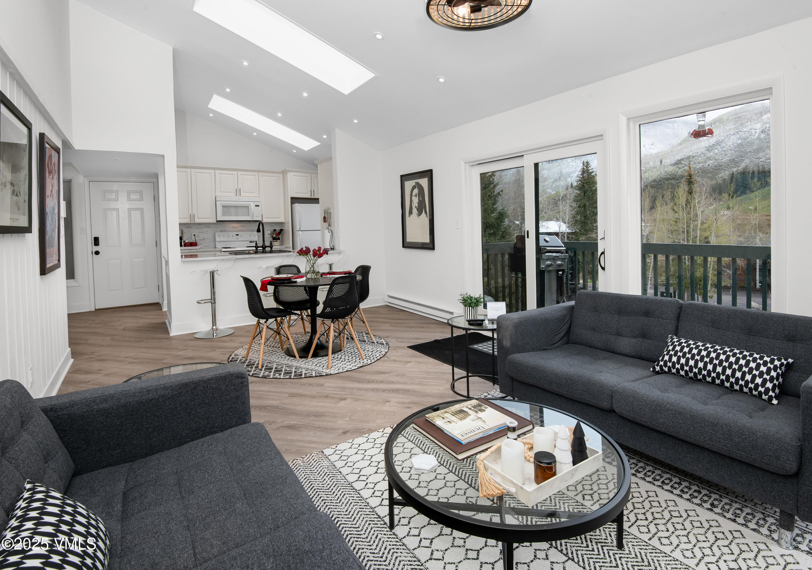 4480 Timber Falls Court, Unit 1507 Vail, CO 81657 - Photo 7 of 29 a living room with furniture and a chandelier
