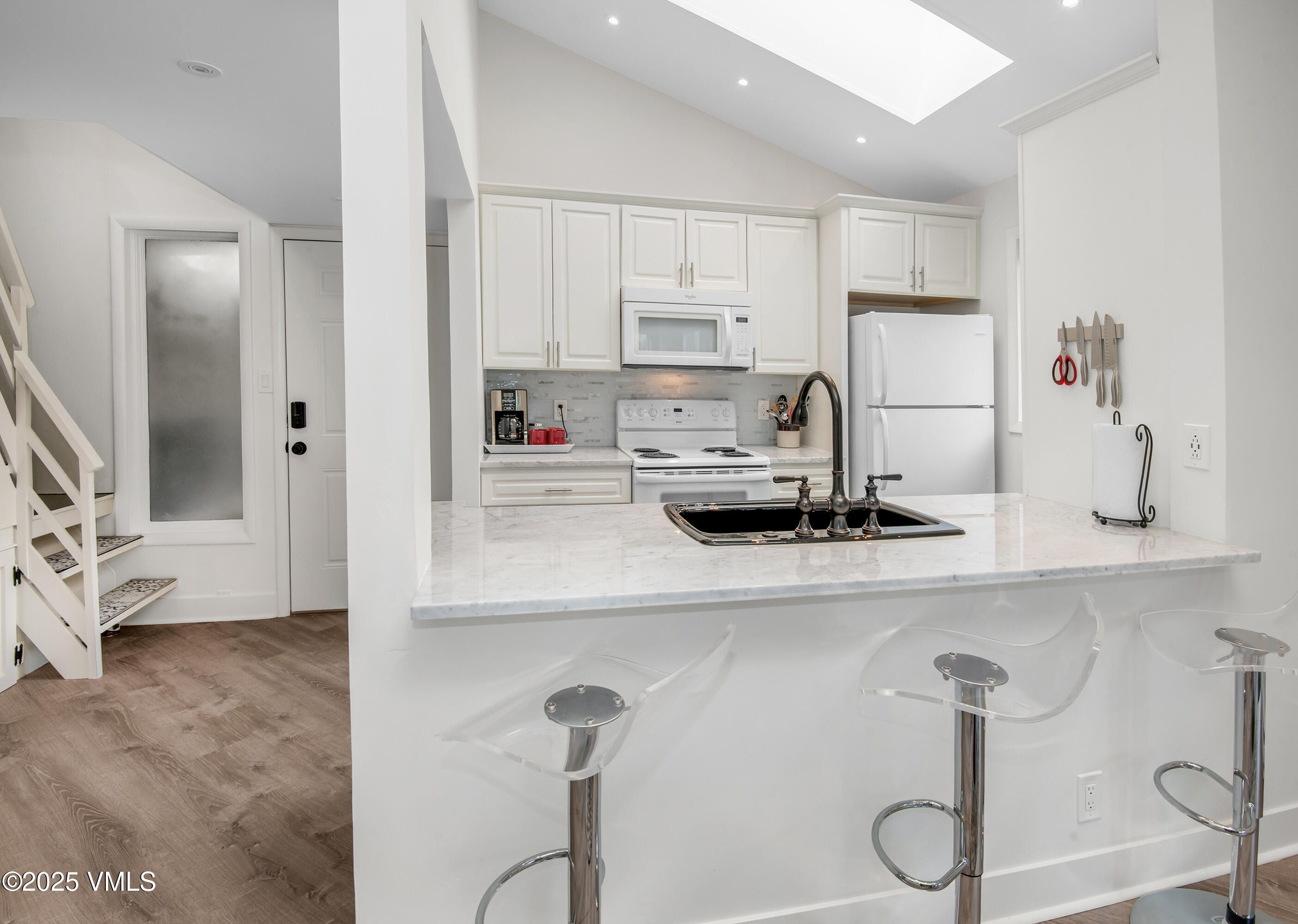 4480 Timber Falls Court, Unit 1507 Vail, CO 81657 - Photo 9 of 29 a kitchen with appliances cabinets and a sink