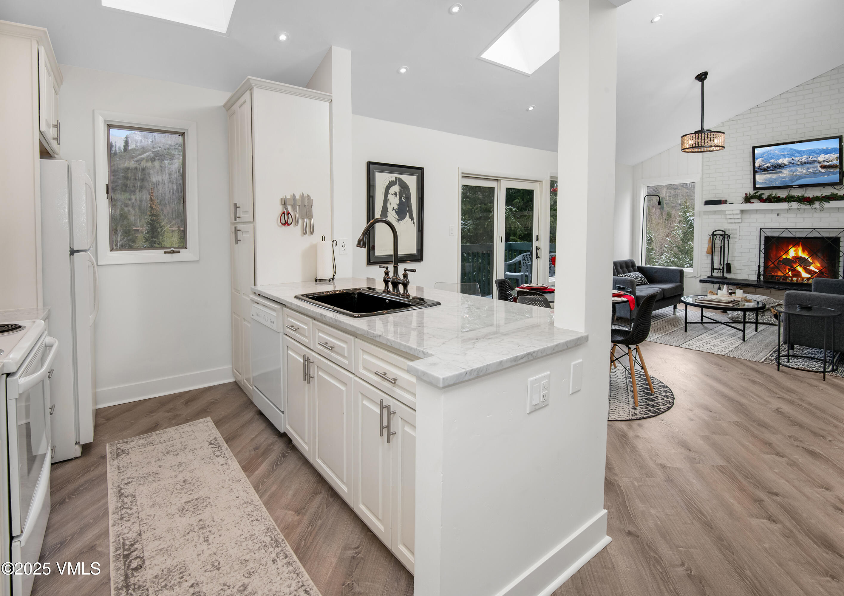 4480 Timber Falls Court, Unit 1507 Vail, CO 81657 - Photo 10 of 29 a kitchen with stainless steel appliances granite countertop a stove and a refrigerator