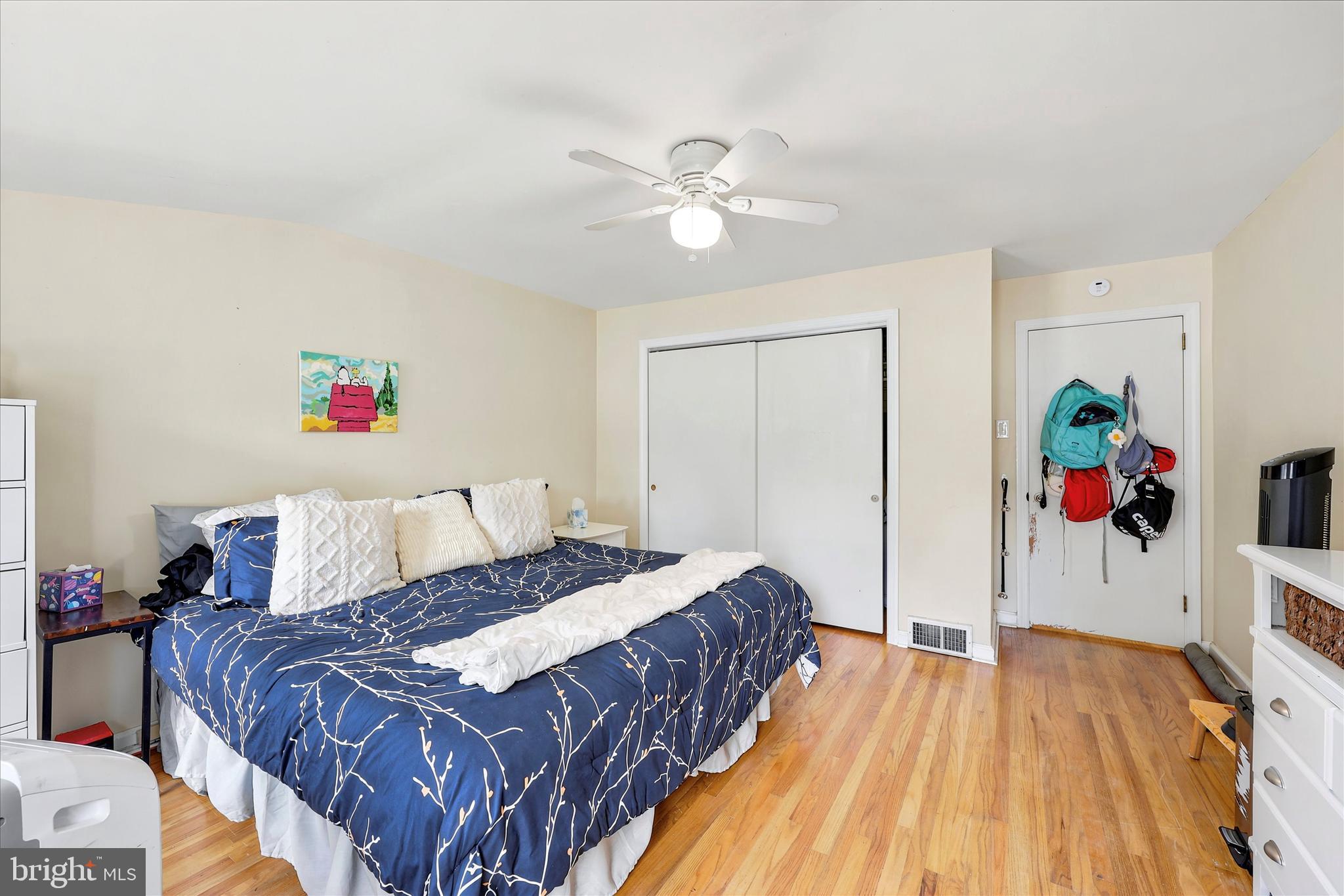 39 Haverford Road Ardmore, PA 19003 - Photo 19 of 24 a bedroom with a bed and a chandelier