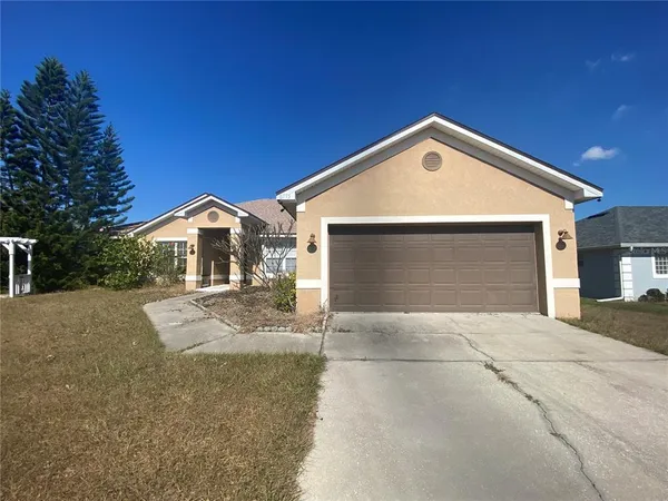 a view of garage and yard