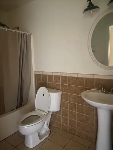 a bathroom with a toilet and a sink