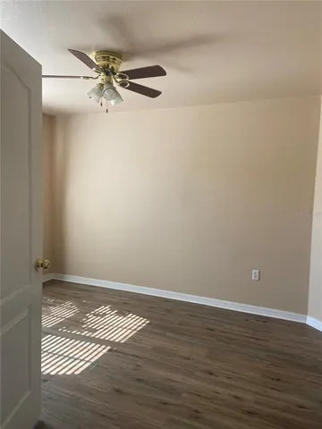 a view of room with wooden floor