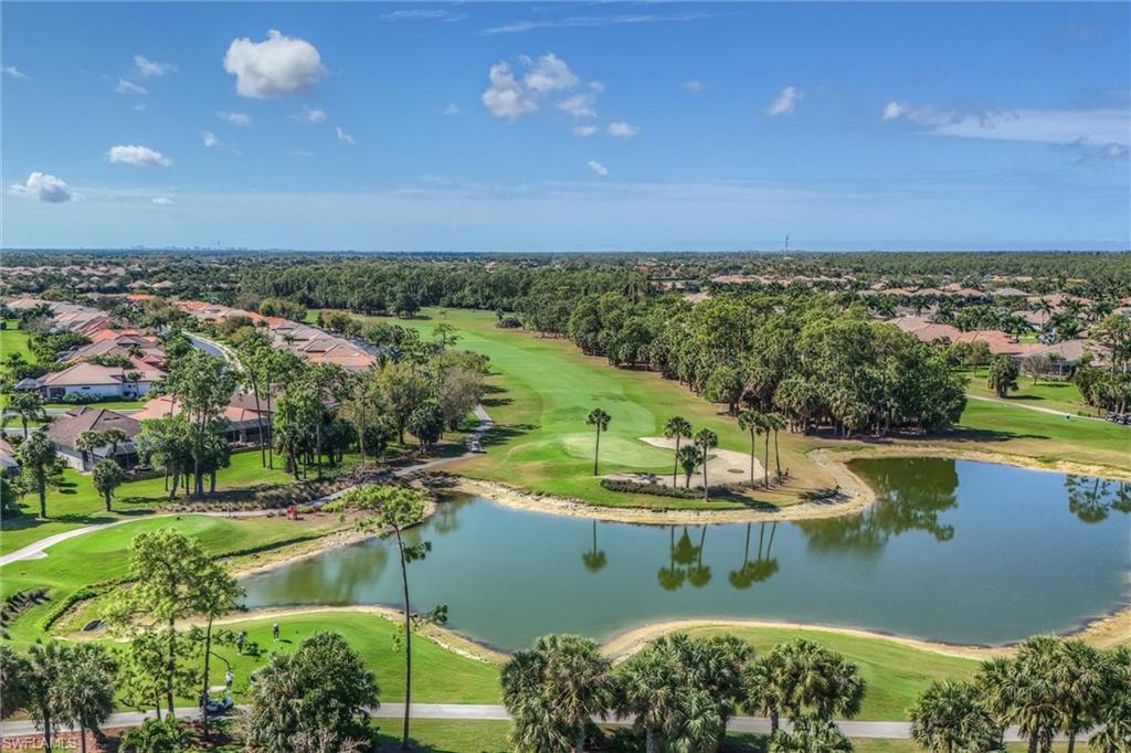 7587 Moorgate Point Way Naples, FL 34113 - Photo 39 of 47 an aerial view of a house with a lake view