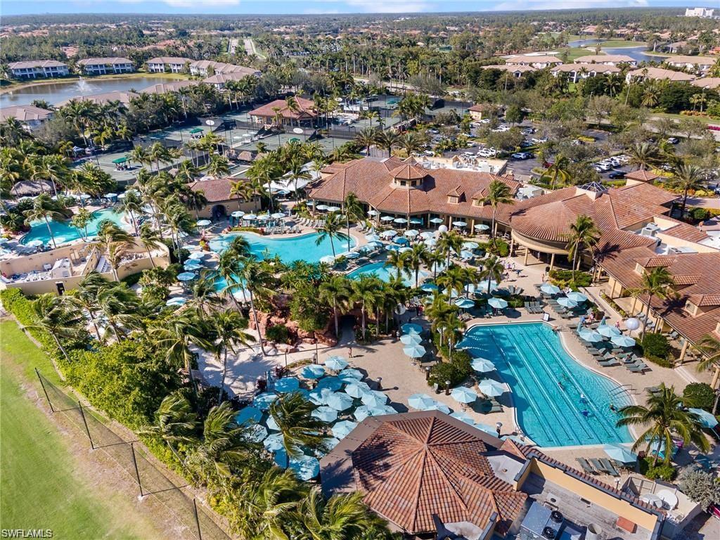 7587 Moorgate Point Way Naples, FL 34113 - Photo 45 of 47 an aerial view of a city with lots of residential buildings
