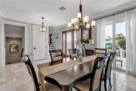 a kitchen with granite countertop a stove a sink and a cabinets