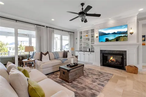 a view of a dining room with furniture wooden floor and chandelier
