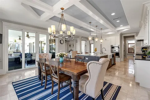 a living room with furniture window and a flat screen tv