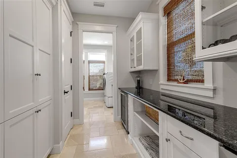 a living room with furniture a rug and a chandelier