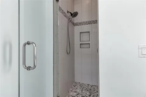 a bathroom with a sink and shower