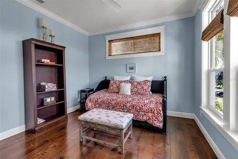 a bathroom with a granite countertop sink and a window