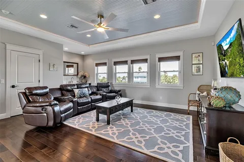 an aerial view of a house with yard swimming pool and outdoor seating