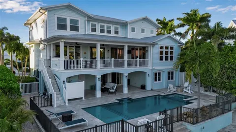 a living room with furniture a fireplace and a table