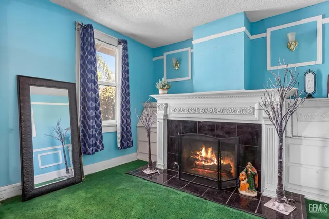 a living room with a fireplace and a window