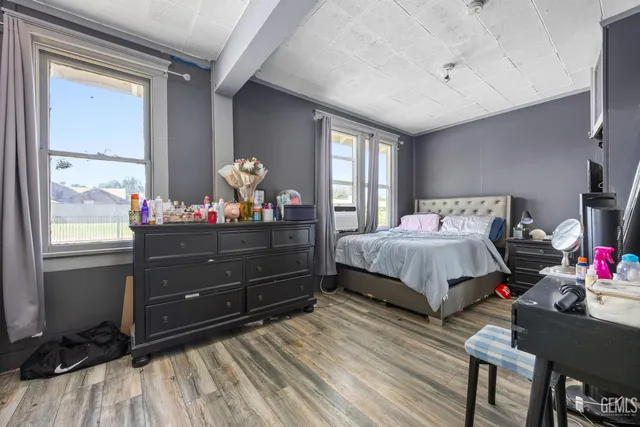 a bedroom with a bed and window