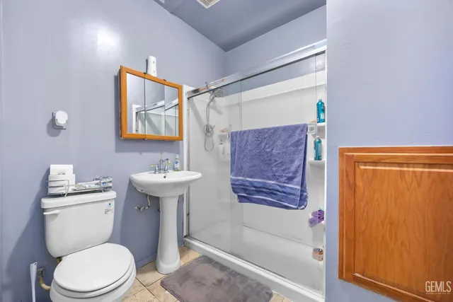 a bathroom with a toilet a sink and bathtub