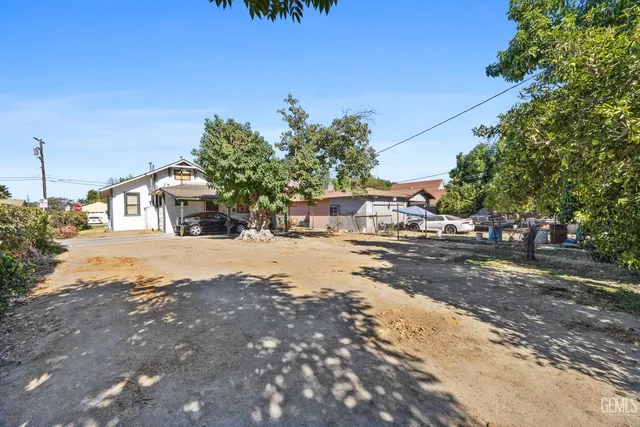 a street view with large trees