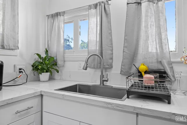 a kitchen with a sink and a window