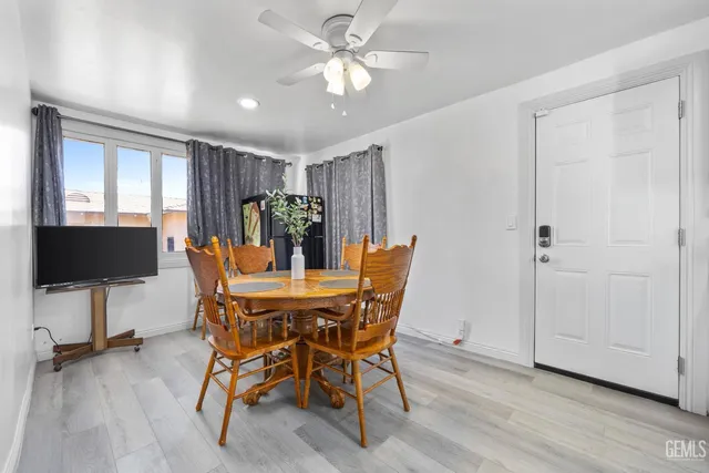 a view of a dining room with furniture and wooden floor