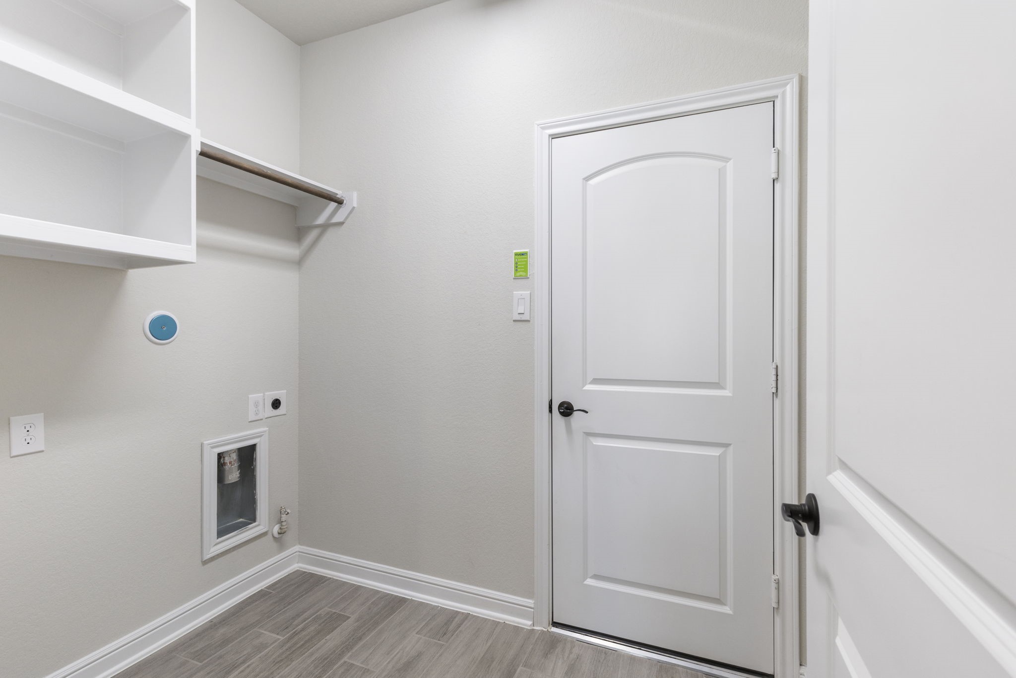 2819 Bradbury Hills Road Spring, TX 77373 - Photo 26 of 50 This sleek utility/laundry room offers ample storage and organization space, featuring modern shelving and fresh, clean design for efficient functionality.
