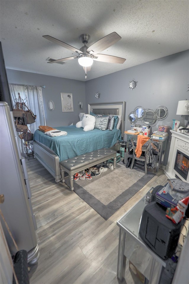 4199 Cedartree Drive Memphis, TN 38141 - Photo 9 of 12 a living room with furniture and a chandelier