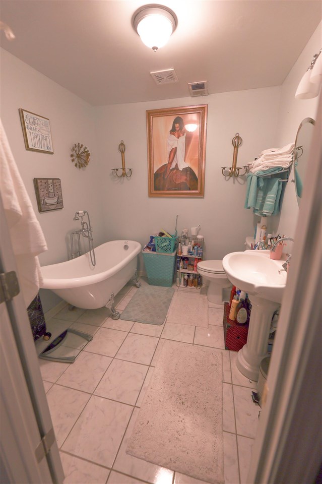 4199 Cedartree Drive Memphis, TN 38141 - Photo 10 of 12 a bathroom with a toilet sink and mirror