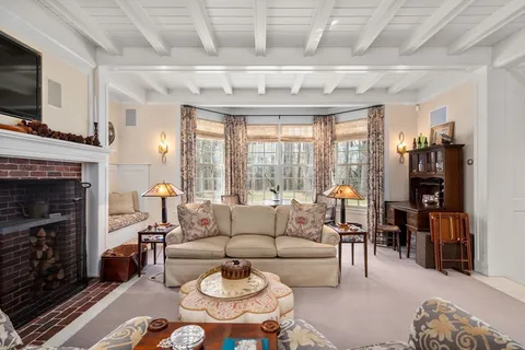 a view of a house with backyard sitting area and garden