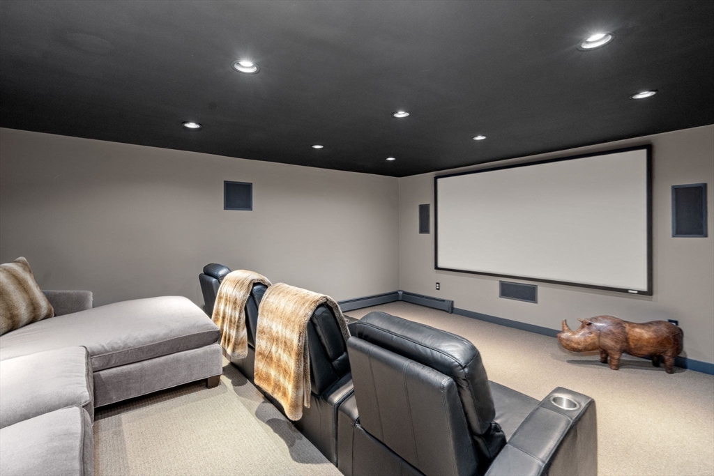 4 Claybrook Road Dover, MA 02030 - Photo 24 of 42 a room with furniture and a projector screen