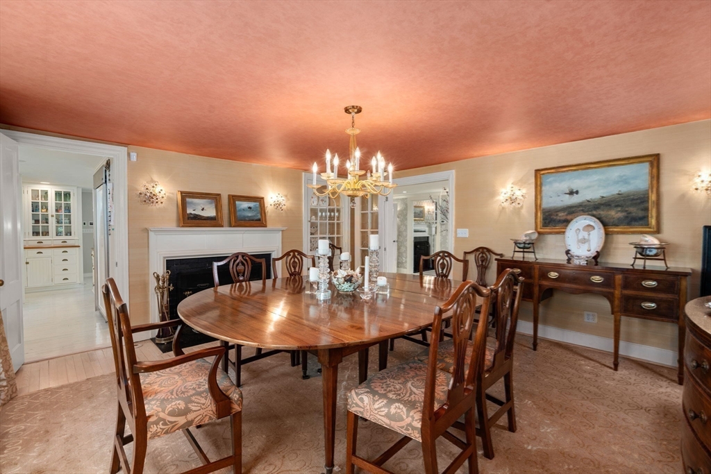 4 Claybrook Road Dover, MA 02030 - Photo 6 of 42 a view of a dining room with furniture and chandelier