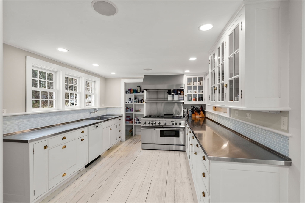 4 Claybrook Road Dover, MA 02030 - Photo 8 of 42 a large kitchen with stainless steel appliances granite countertop a lot of counter space and wooden floors