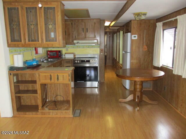 3100 South Kinney Road, Unit 193 Tucson, AZ 85713 - Photo 9 of 35 a kitchen with stainless steel appliances granite countertop a stove a refrigerator and a cabinets