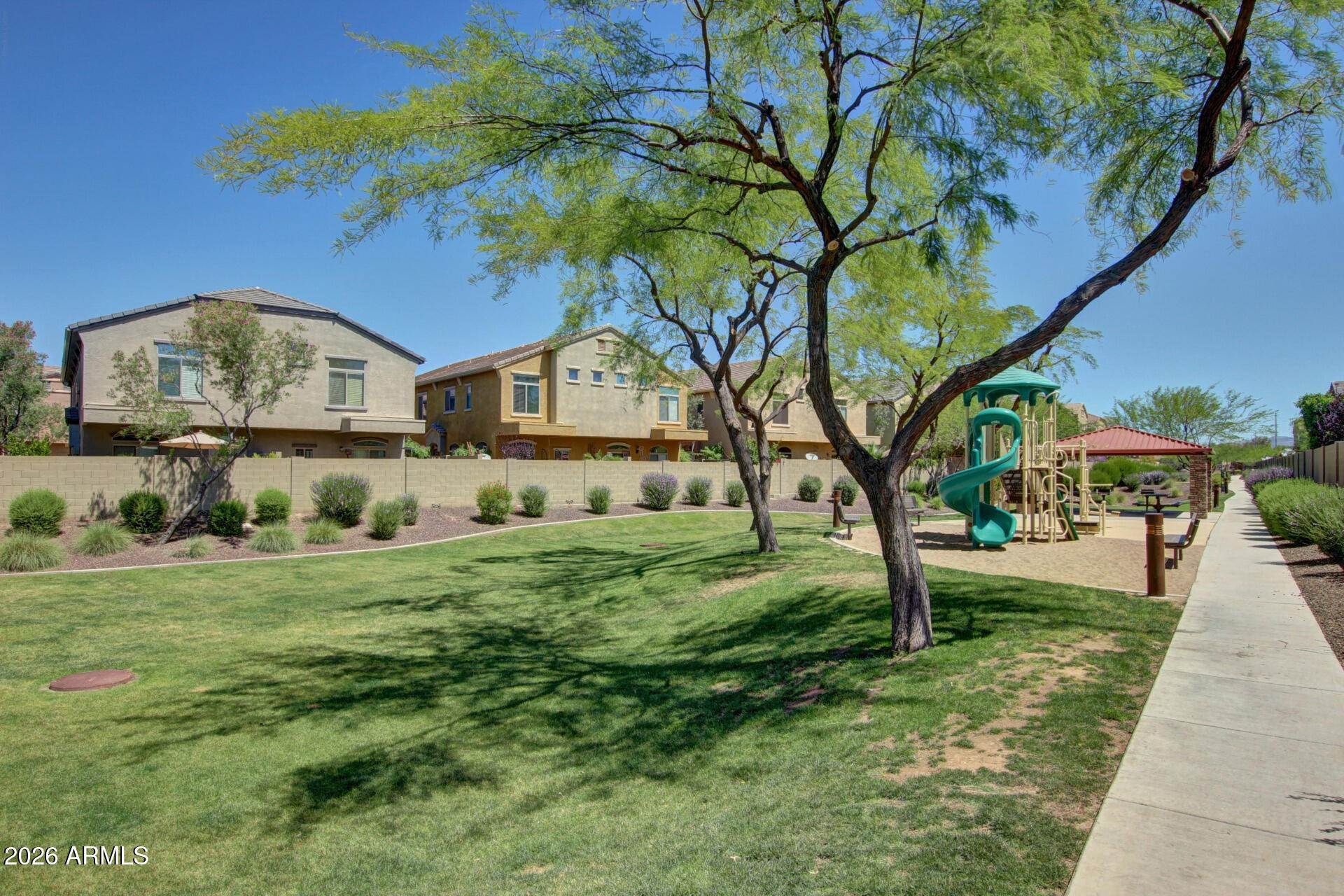 2725 East Mine Creek Road, Unit 1101 Phoenix, AZ 85024 - Photo 37 of 43 a front view of a house with a yard