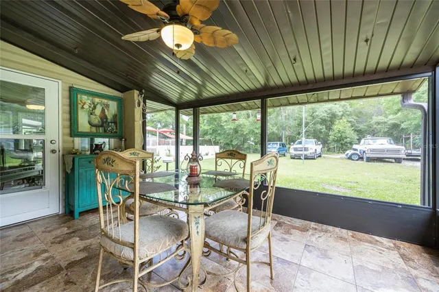 a dining room with furniture and outdoor view