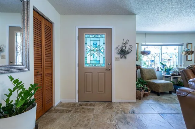 a view of a livingroom with furniture and windows