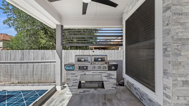 a view of barbecue area with outdoor seating