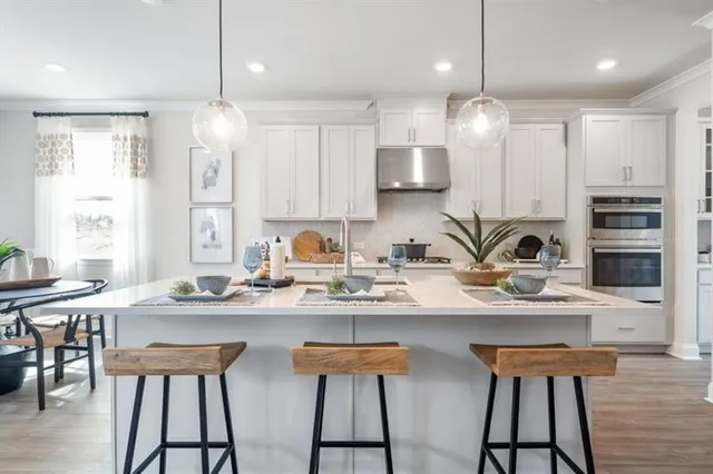 a view of a dining room with furniture and window